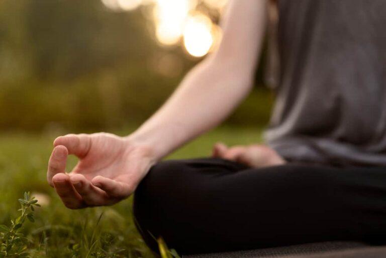 front-view-woman-meditating-nature (1)